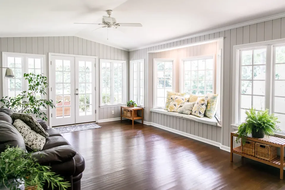 home interior with wood flooring and large windows