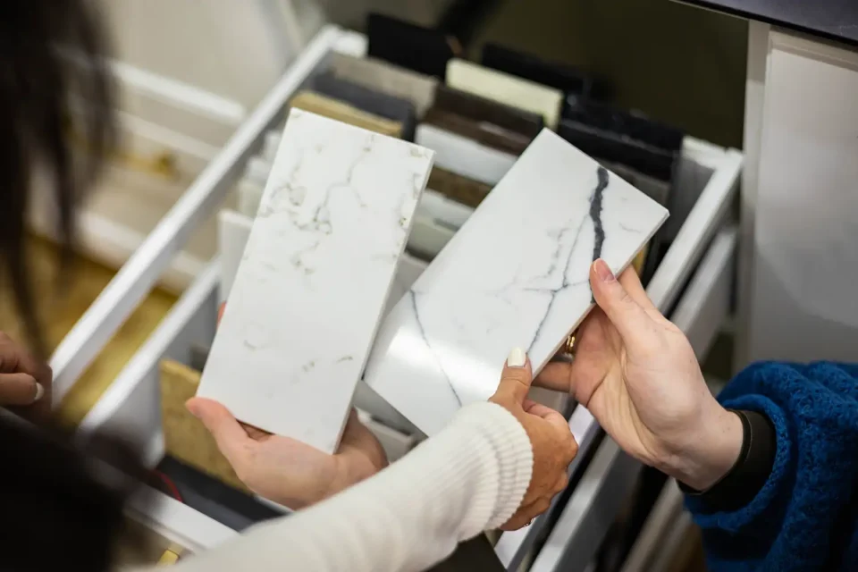 people looking at granite tile samples