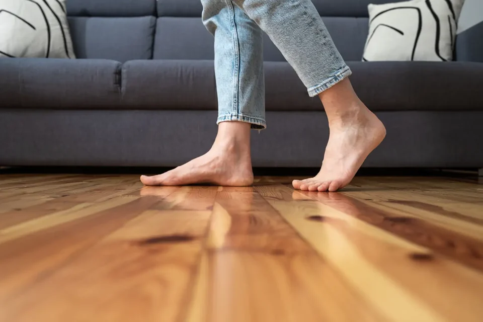 woman walking on wood floor